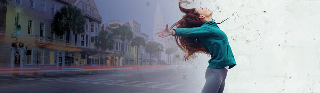 woman dancing down a street