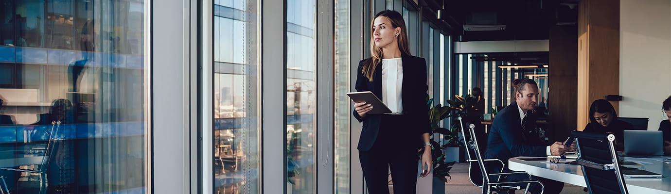 a woman walking the halls of an office