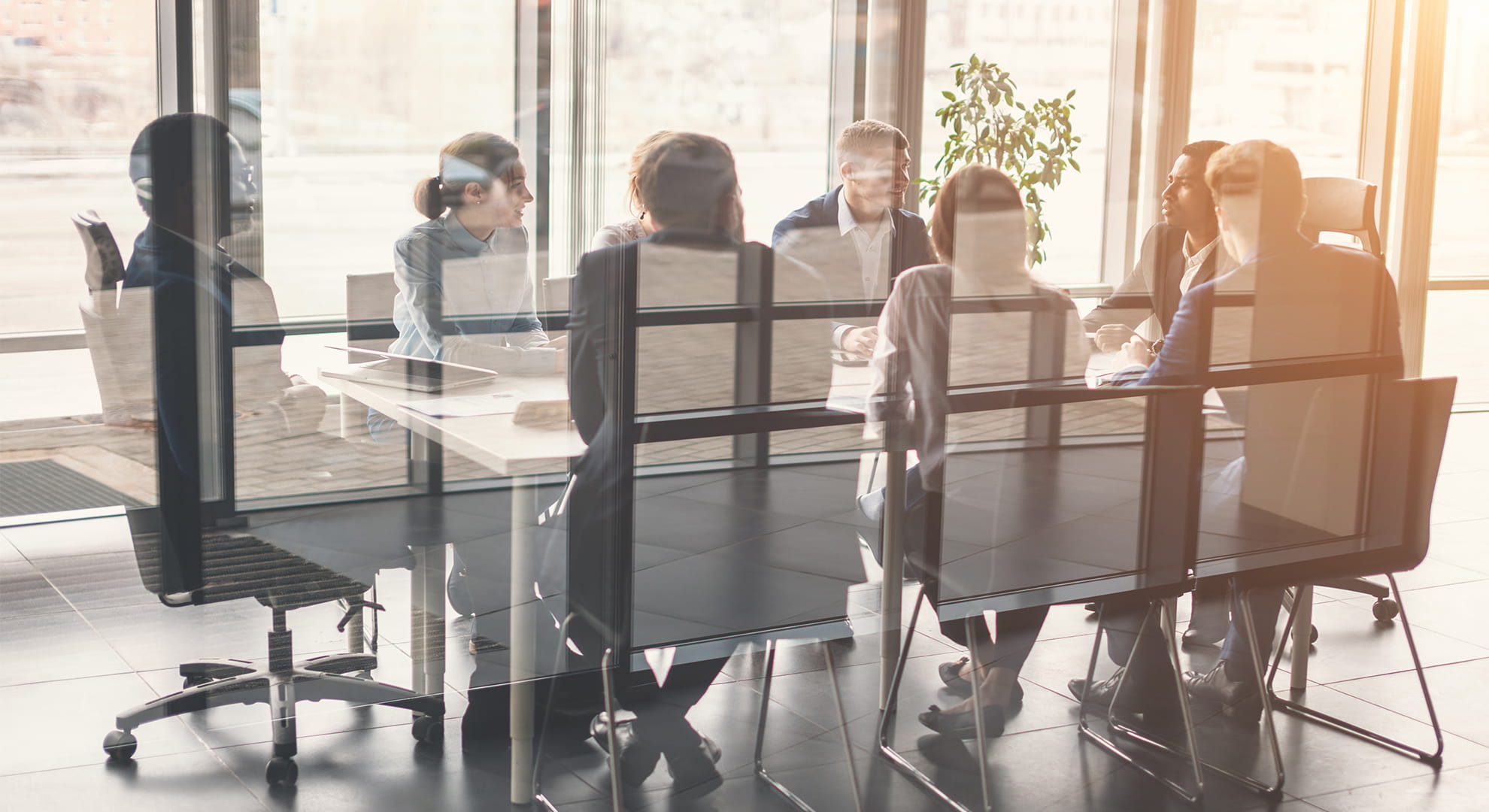 a team sitting at a table for a business meeting