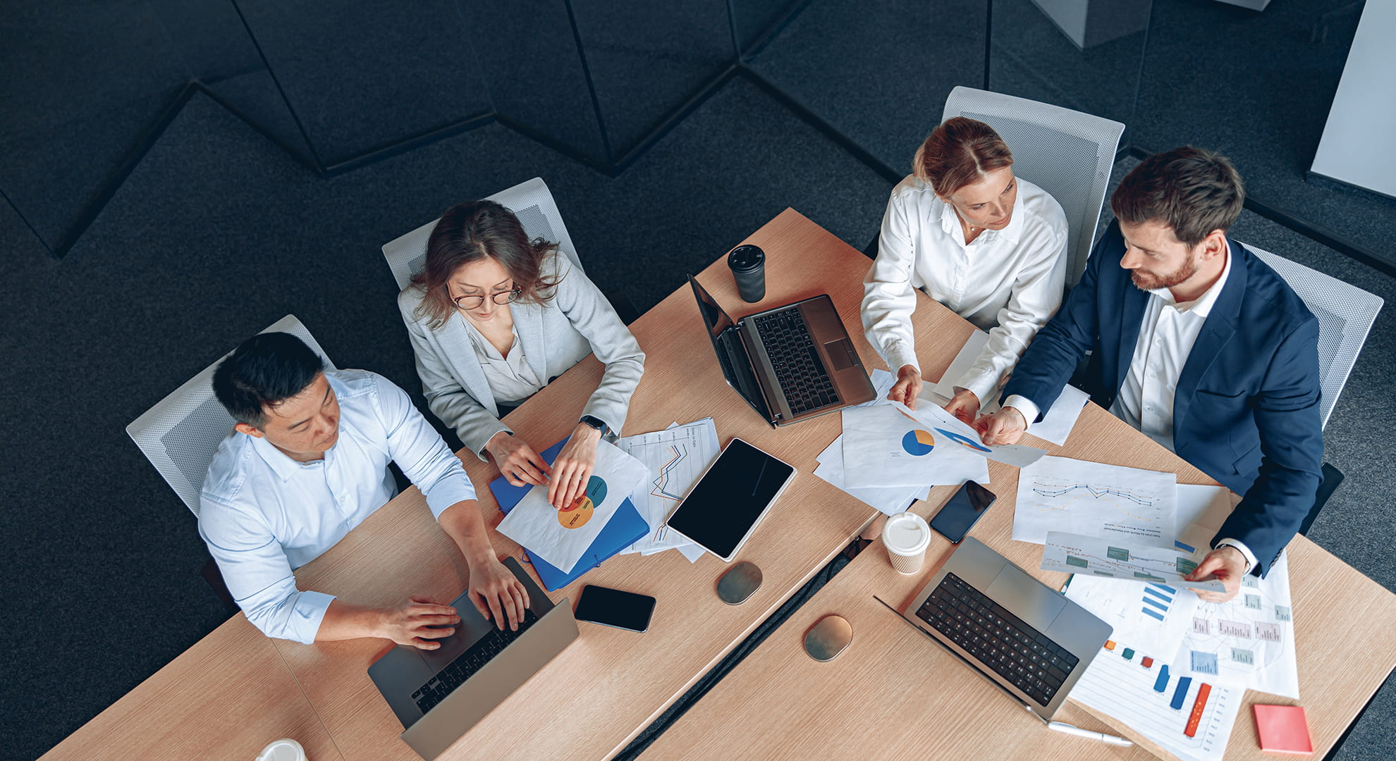 a team of professionals reviewing sets of data