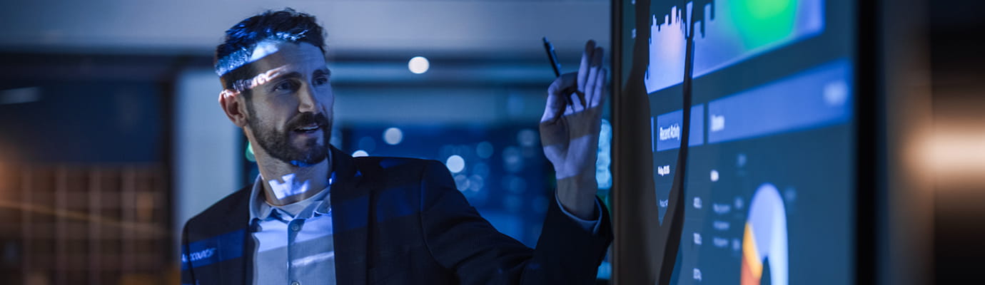 a man giving a presentation on a projector 