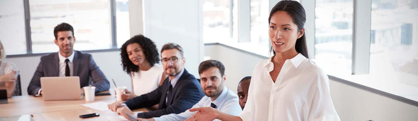 demonstrating to colleagues in meeting room