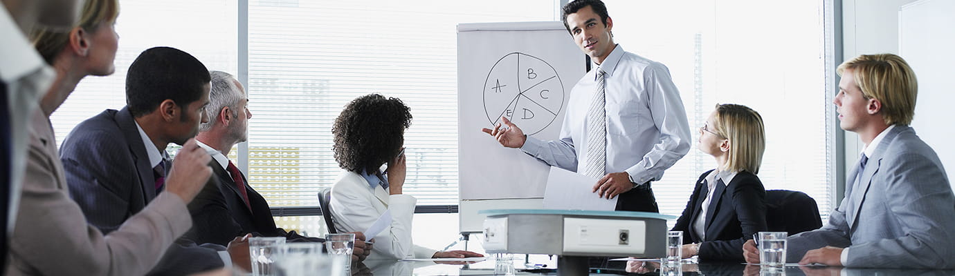 a team looking at a pie chart