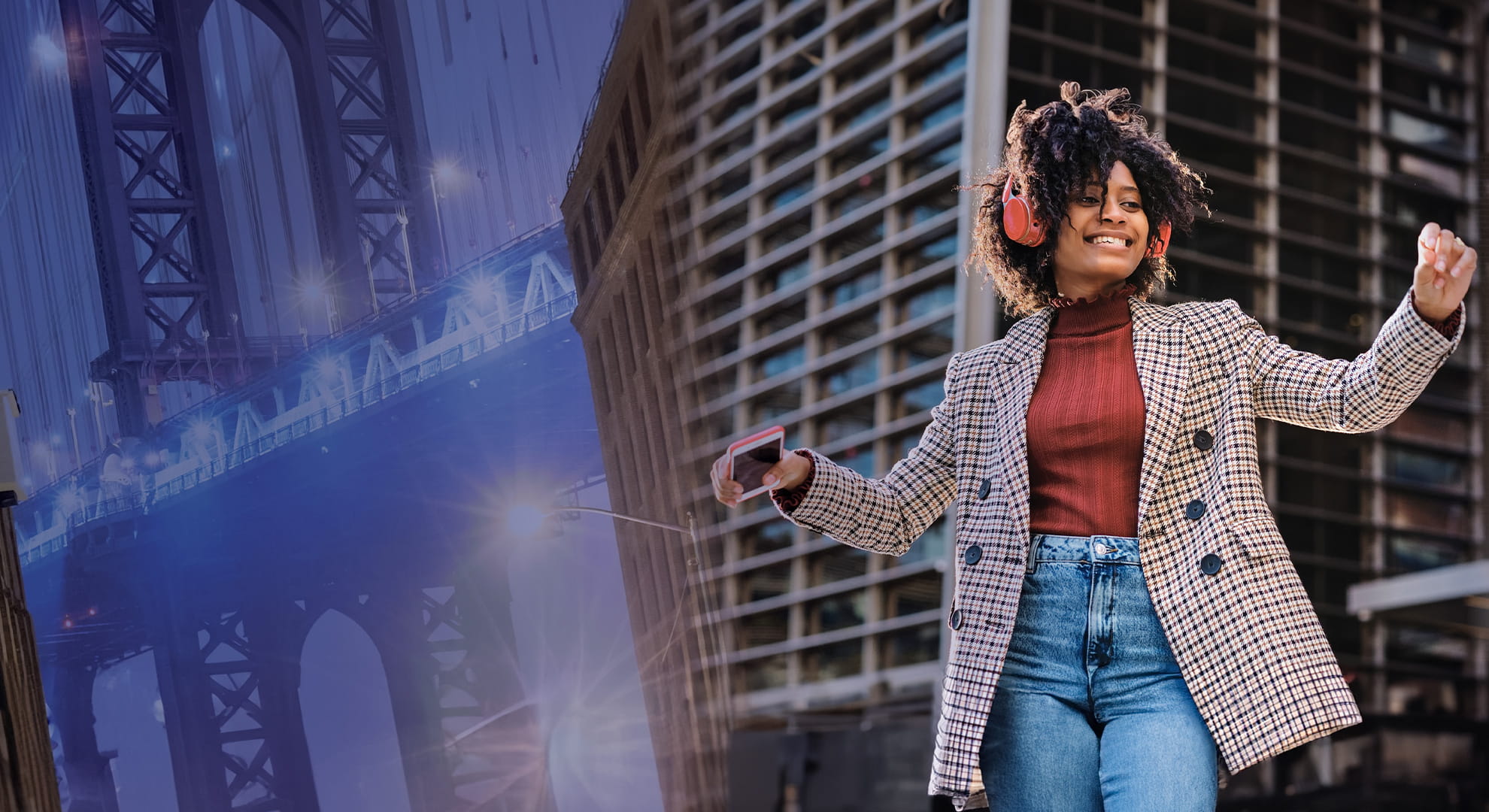 a woman dancing in front of a building